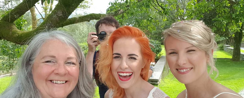 Wedding coordinator, Caroline with two beautiful brides and a great wedding photographer Tom McNally