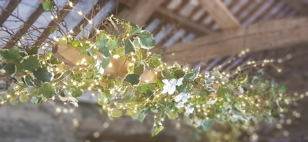 Barn Wedding Decor - Hanging Flower Display above dining table
