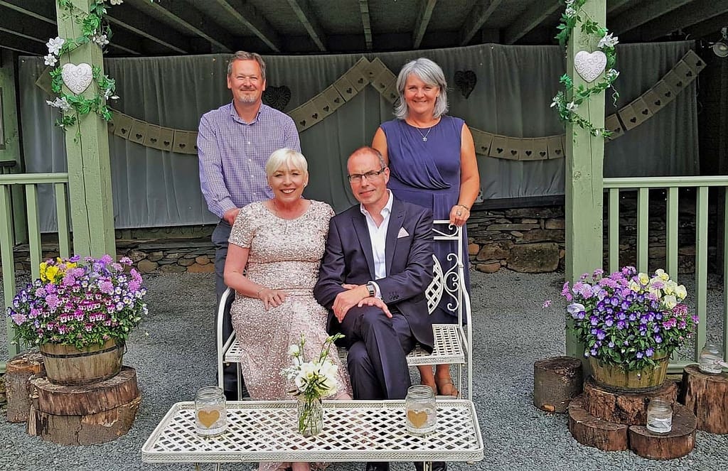 Wedding Couple with owners of venue