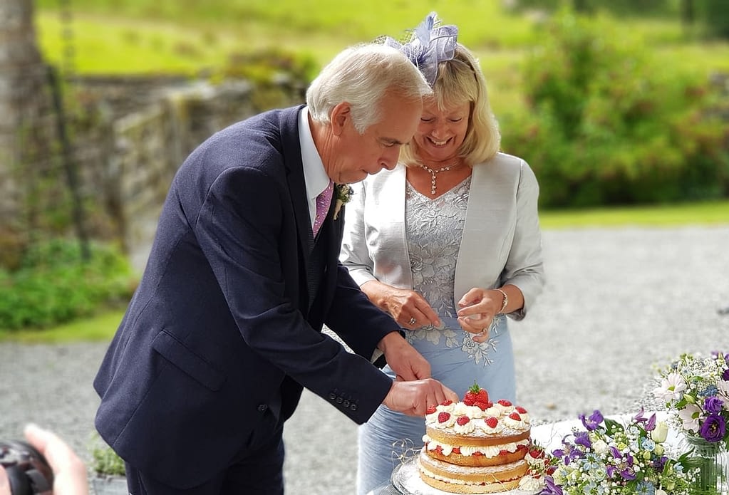 bride and Groom cutting wedding cake