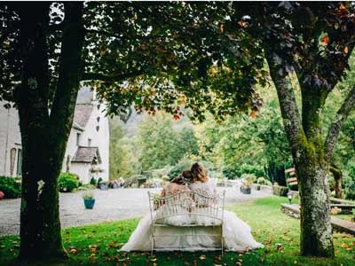 Two-brides-relaxing-in-the-gardens-at-Cote-How-by-Rachel-Joyce