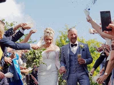 Confetti throwing symbolising Good Luck for the newly married couple
