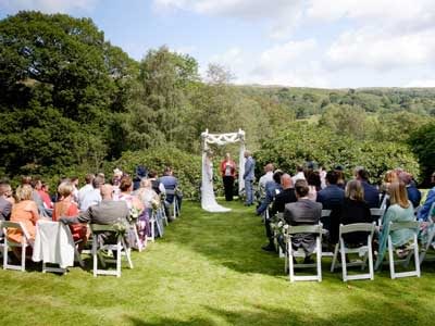Humanist Wedding ceremony taking place outside on the lawn
