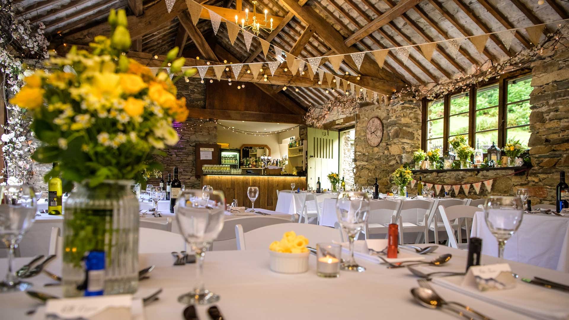 Wedding Breakfast set up in the wedding barn at Cote How