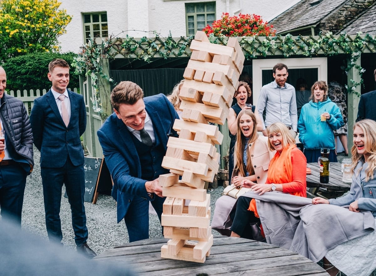 Family Fun Wedding playing Jenga outdoors