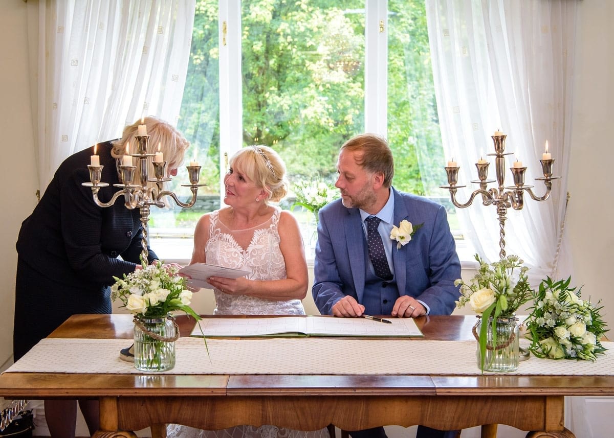 Getting-Married---The-Registrar-giving-the-official-Marriage-Certificate