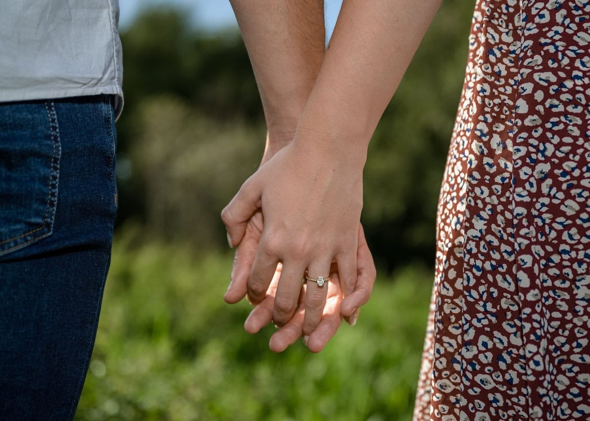 Marriage-Proposal-Couple-Holding-Hands
