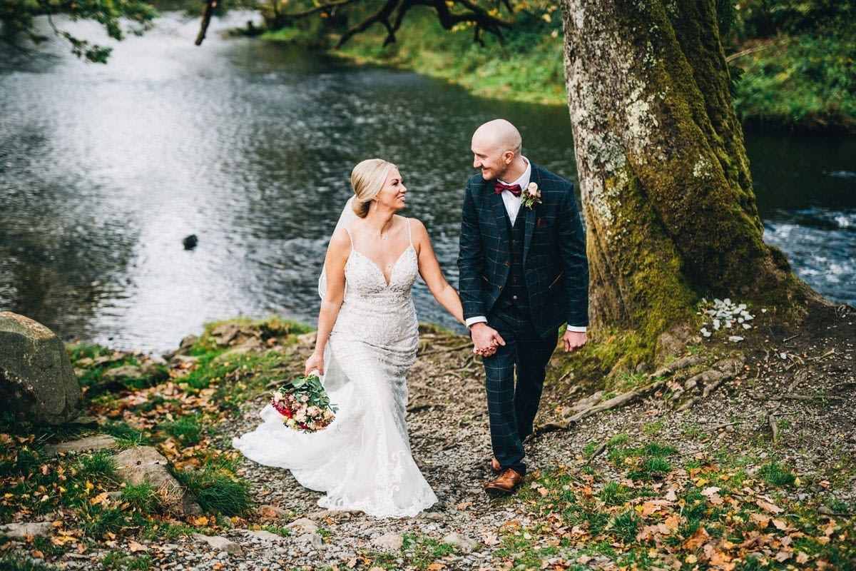 Bride and Groom by the River side of the Rothay River next to Cote How Lake District weddings