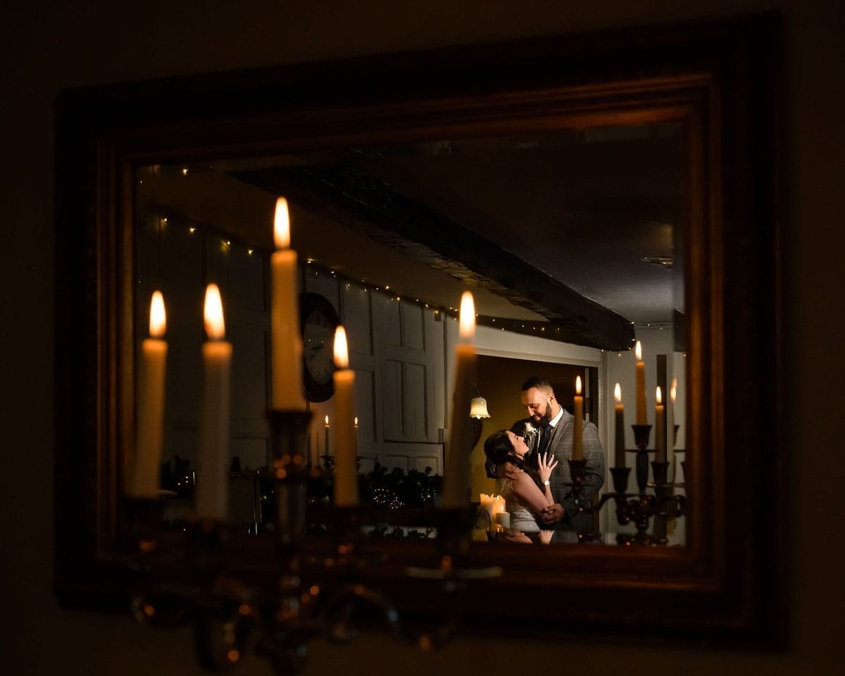 Candlelit-elopement-couple-in-mirror
