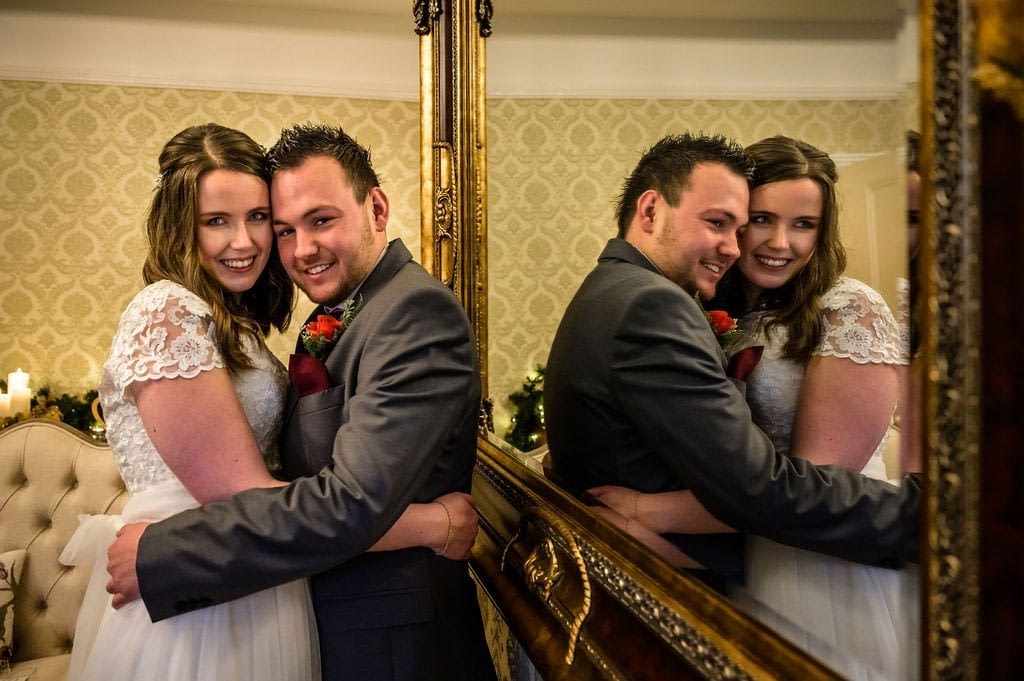 Wedding-couple-pictured-with-mirror-reflection