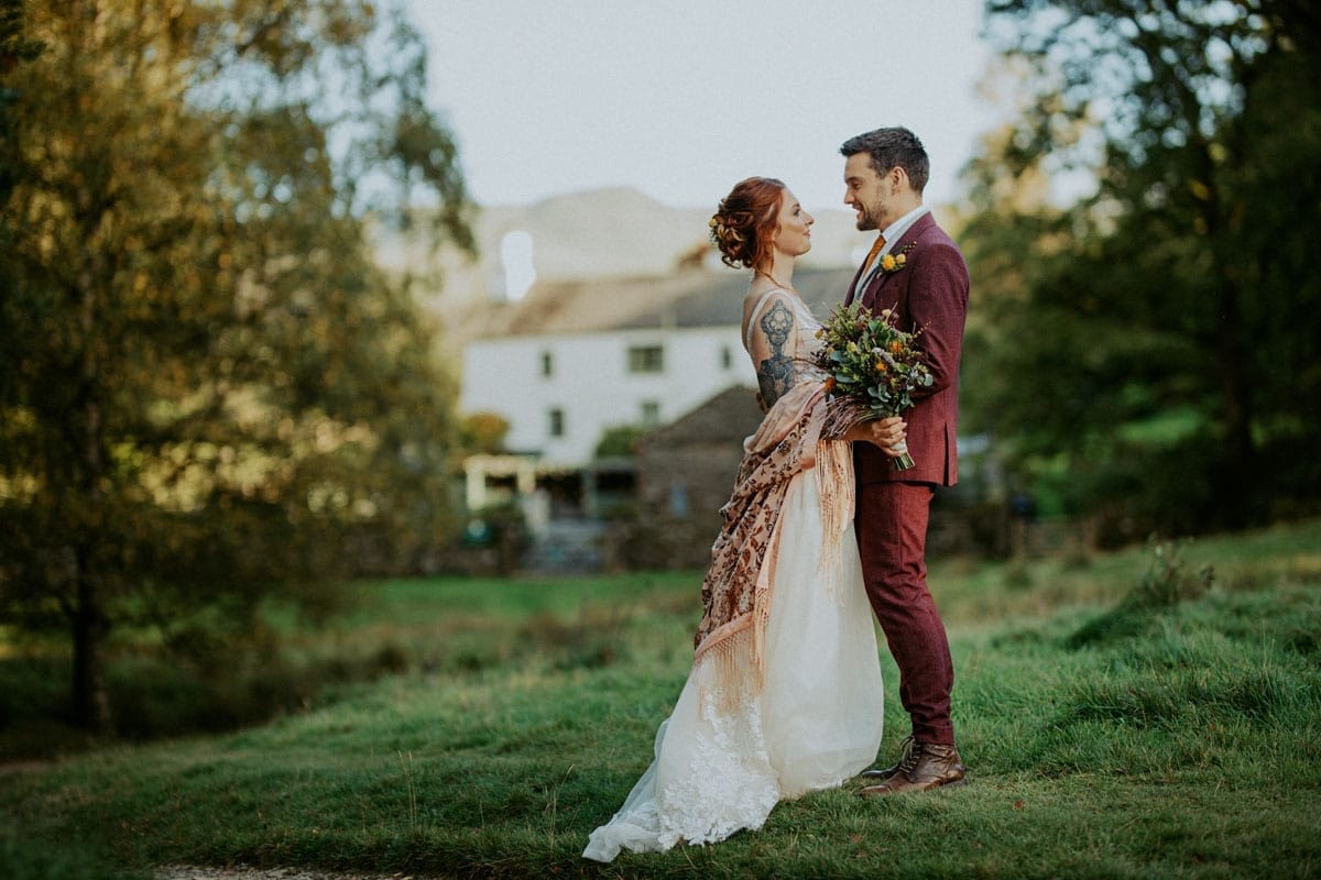 Bride and Groom outside Cote How for an autumnal wedding