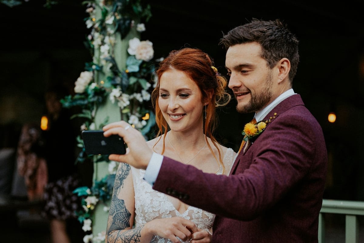 Wedding couple video calling guests