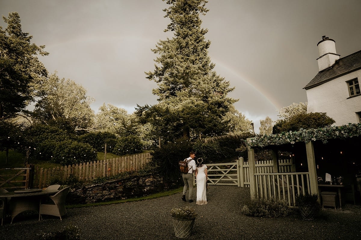 Rainbow over wedding couple at Cote How