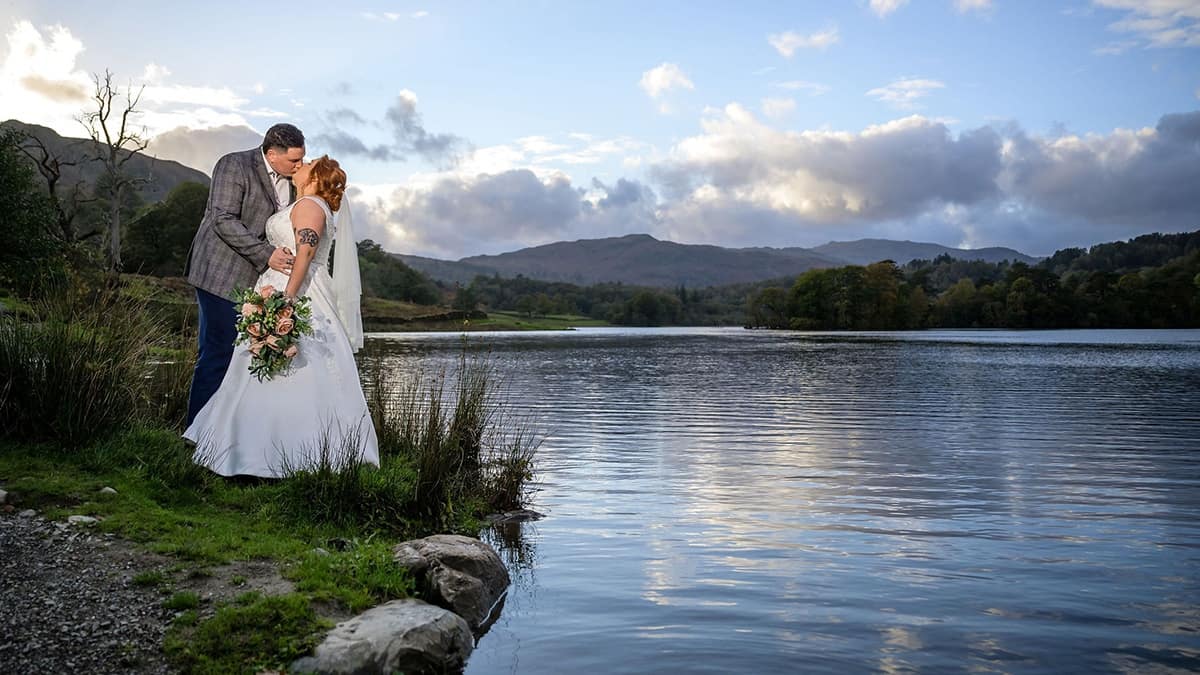 Elopement couple on the edge of Rydal Water