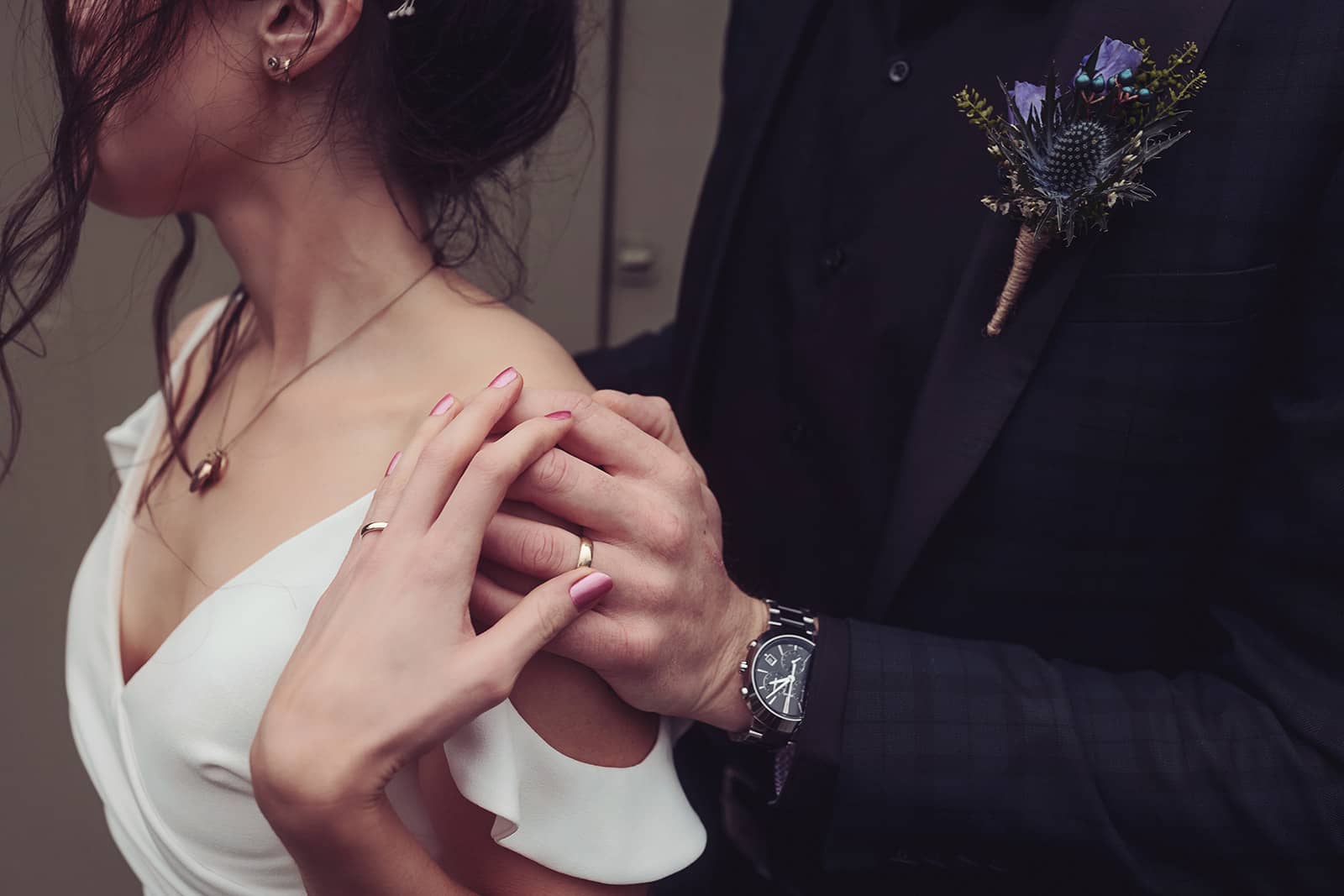 Bride and groom outfit details for winter elopement wedding
