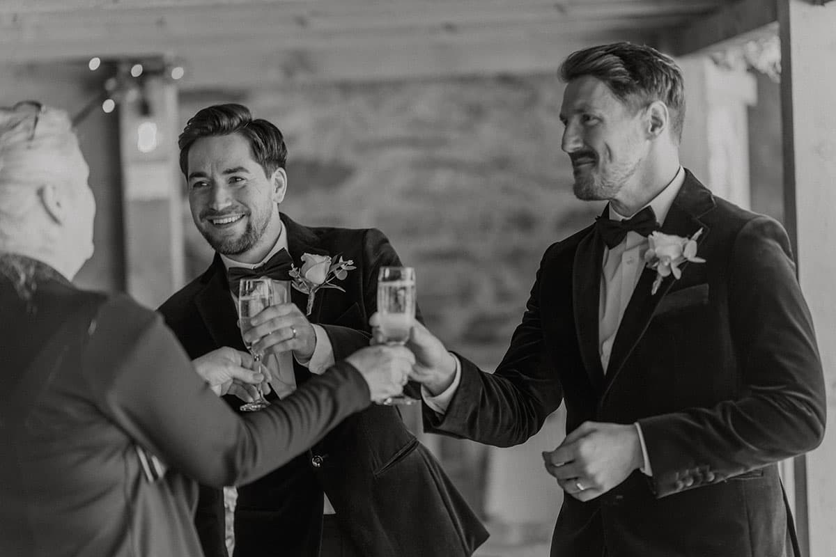 Caroline is giving two grooms prosecco after the ceremony