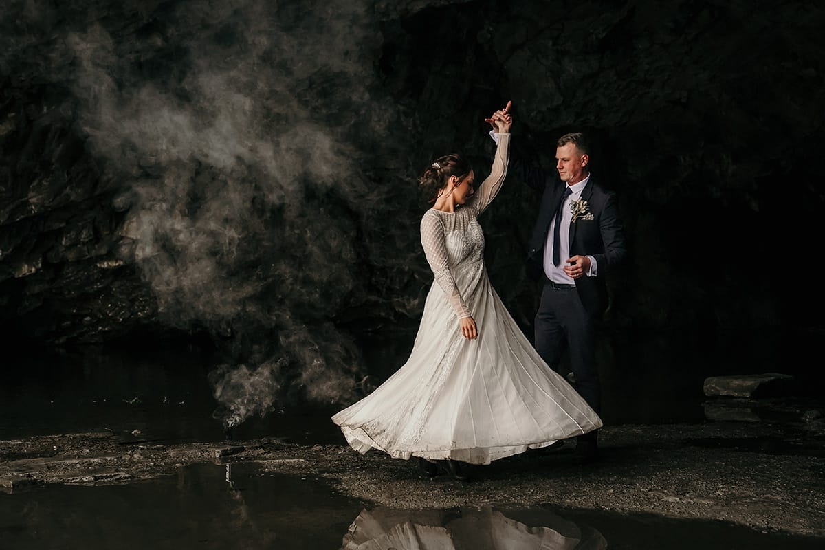 Valentines day wedding couple dancing in Rydal Caves